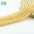 Perles de jade jaune rondes en gros rondes naturelles pour le bracelet en stock, L-0155